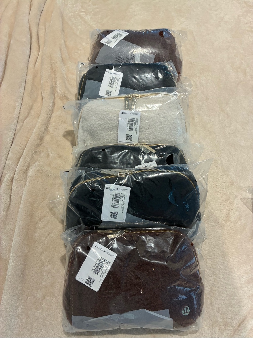 lululemon athletica small zip pouches in brown, black, cream